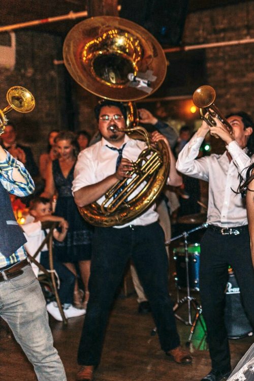 Musicians play brass instruments.